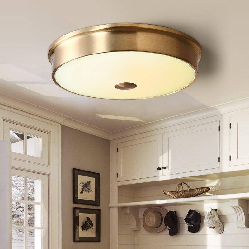 Plafonnier design LED rond en métal doré