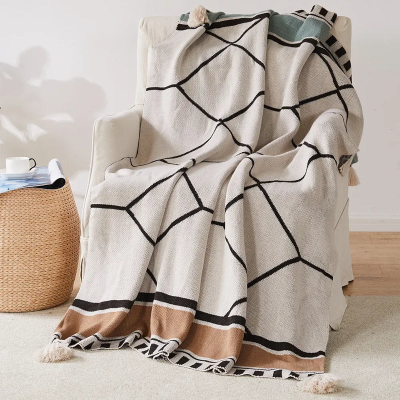 plaid tricoté bohème à pompons motif géométrique doux