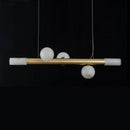barre avec boule suspension table ronde en marbre éclairage salon de thé