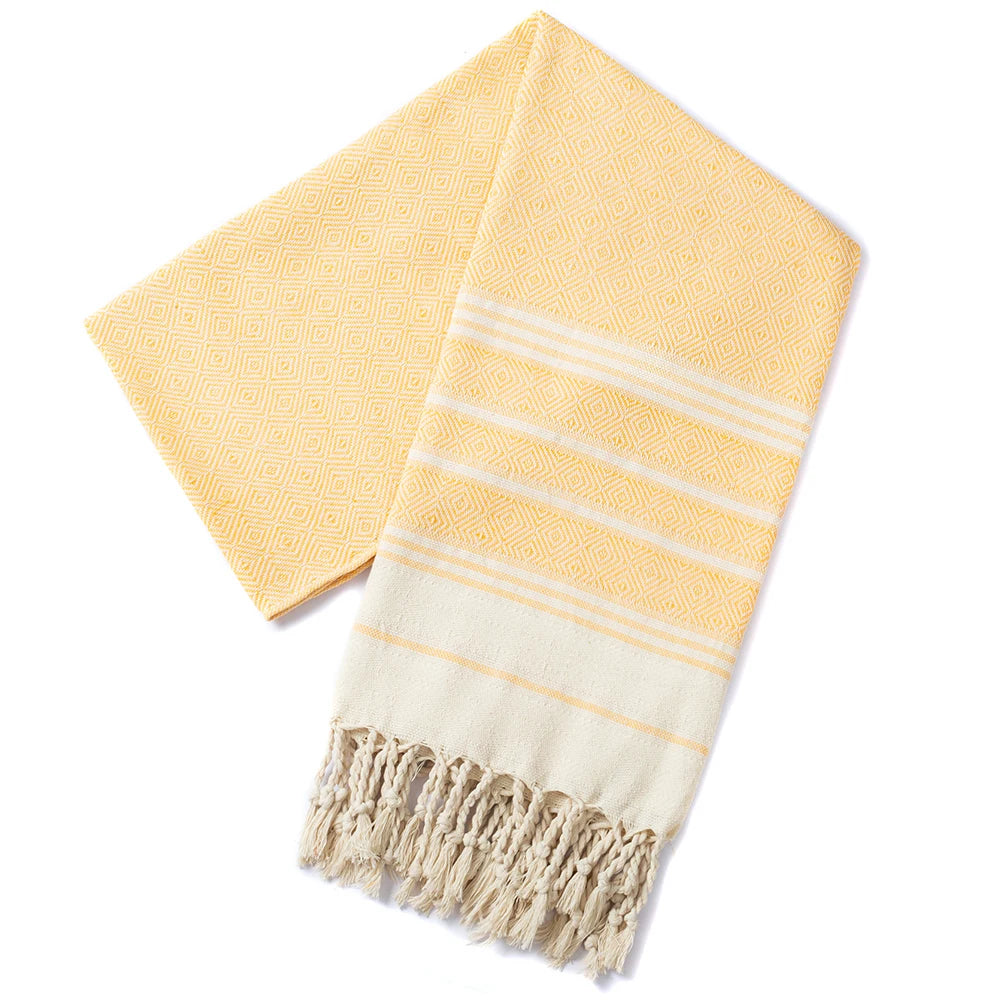Serviette de plage coton motif jacquard losanges pompons
