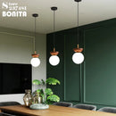 suspension ronde en verre et bois de noyer japonais