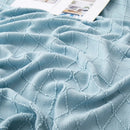 plaid tricoté jacquard à carreaux avec pompons décoratif