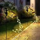 arrosoir solaire avec lumières de jardin et statues de fées