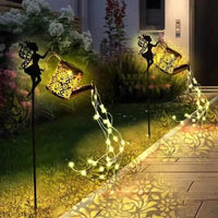 arrosoir solaire avec lumières de jardin et statues de fées
