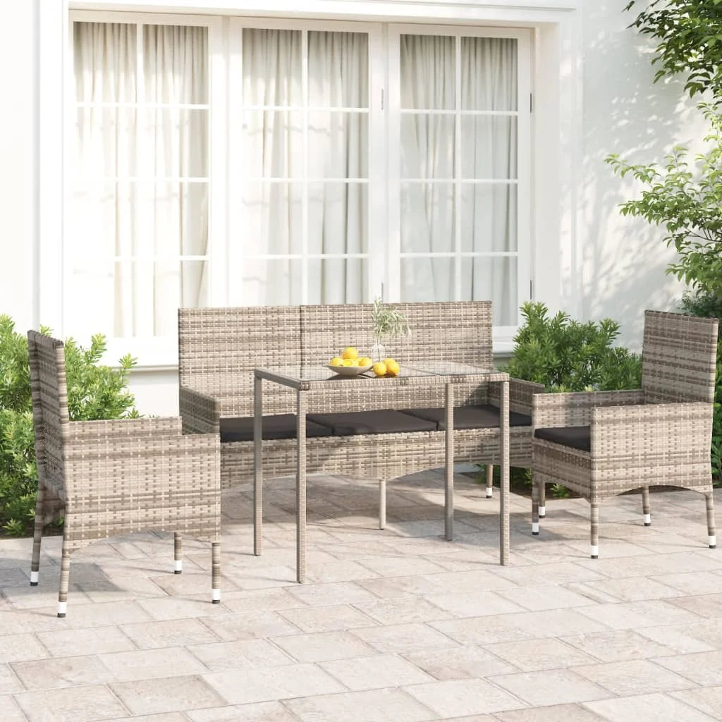 salon de jardin quatre pièces avec coussins tressés en résine