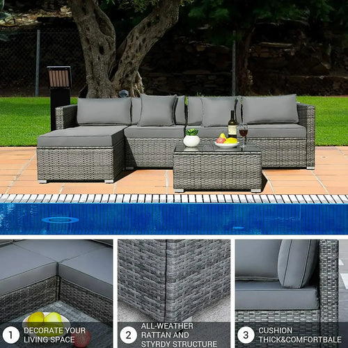 ensemble de canapés dangle de jardin en rotin avec table basse et coussins