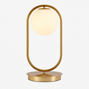 Lampe de chevet design en métal doré et boule en verre