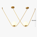 Suspension design boule de verre avec bras doré Arto