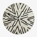 Tapis moderne rond aux formes géométriques noires et blanches Skin