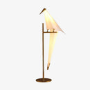Lampe à poser en forme d'oiseau sur branche dorée