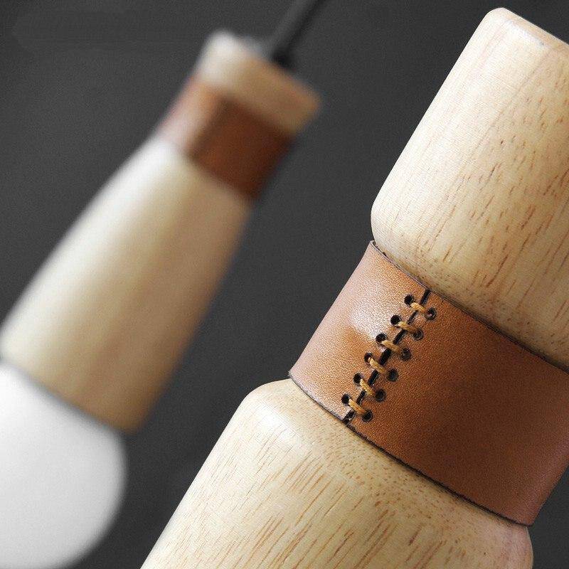 Suspension LED de formes cylindriques en bois avec bracelet simili cuir