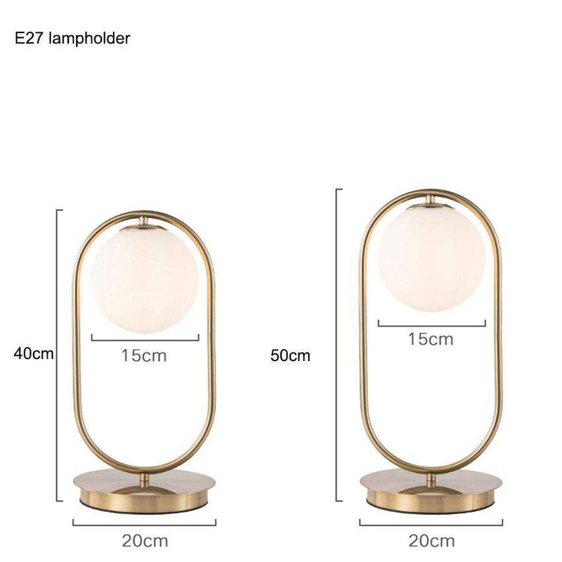 Lampe de chevet design en métal doré et boule en verre