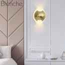 Applique murale design LED arrondie en métal doré Art