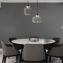 Suspension design LED avec sphère en verre et cercle cuivré
