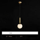 Suspension design LED dorée avec boules en marbre