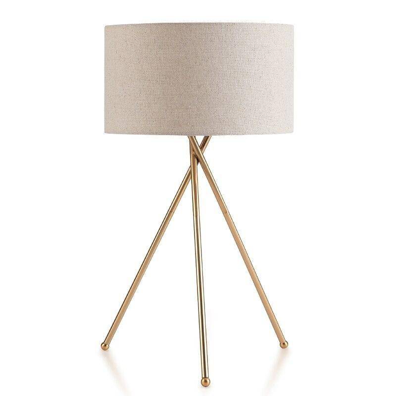 Lampe à poser design dorée avec abat-jour en tissu