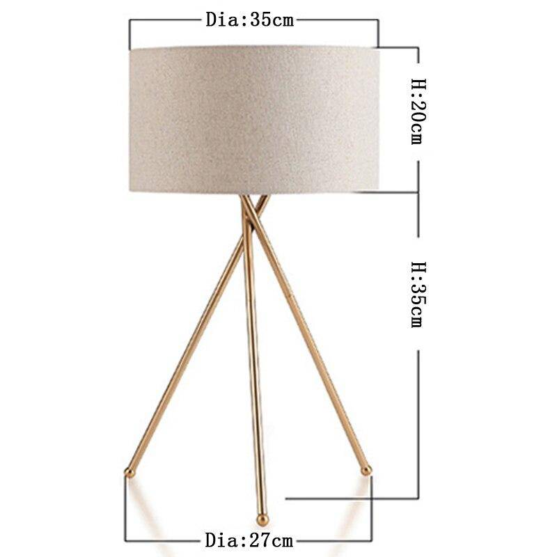 Lampe à poser design dorée avec abat-jour en tissu