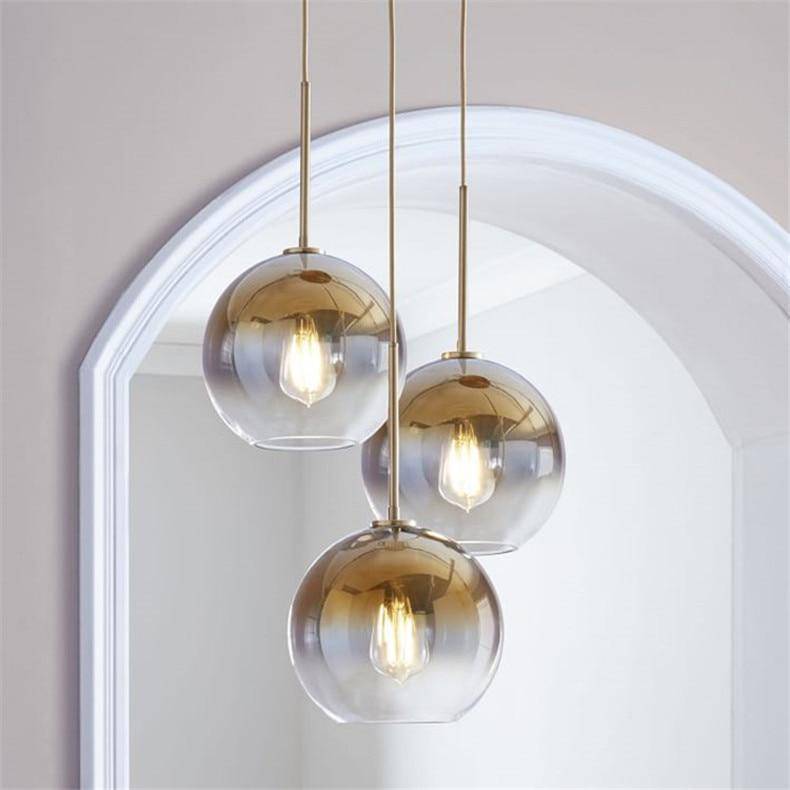 Suspension design boule en verre ambré Loft