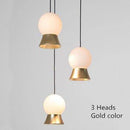 Suspension et lustre design à LED avec boule en verre et support dorée